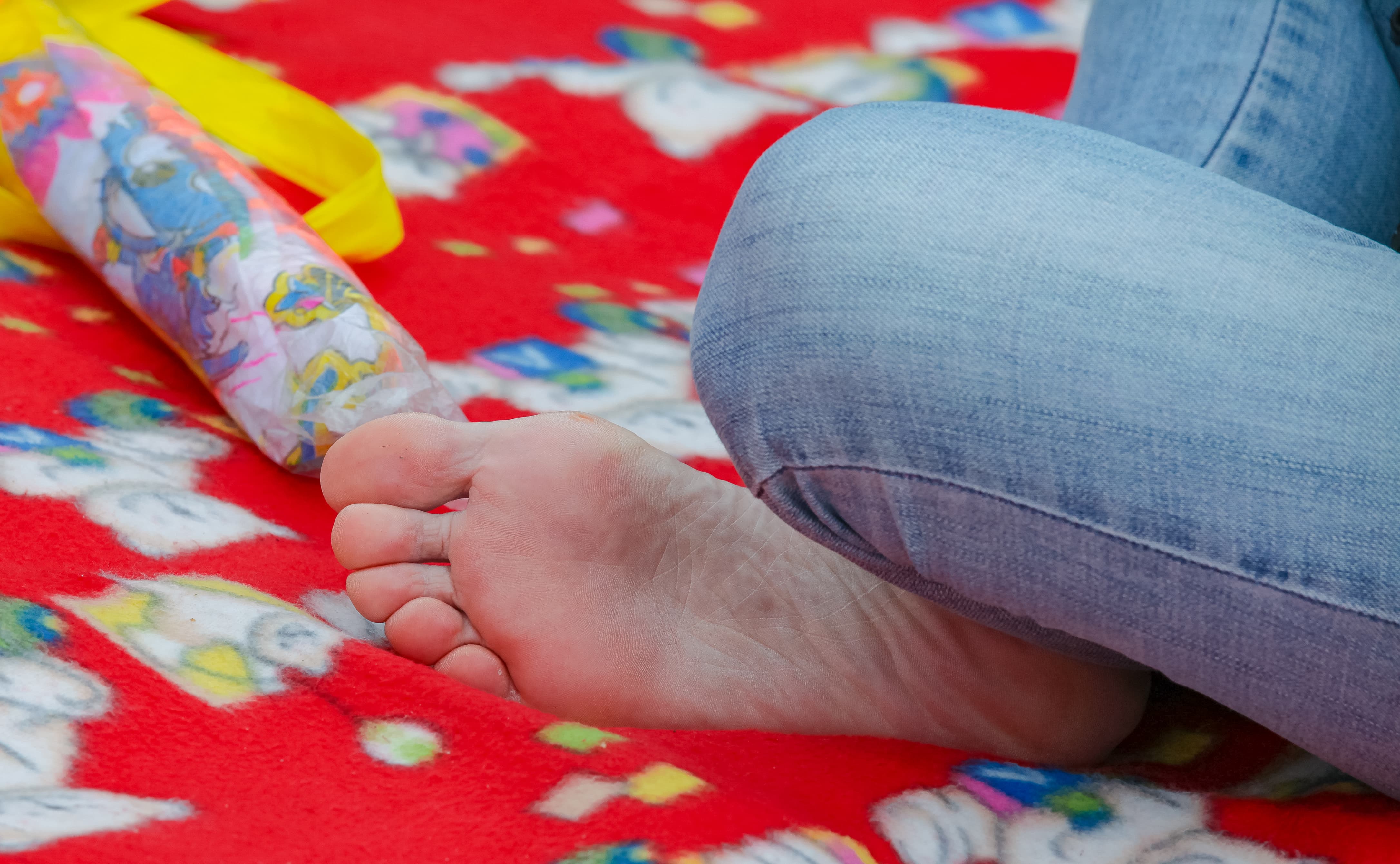 Short-haired woman showing feet